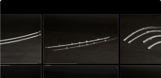 Curved light guide bars glowing in a dark housing